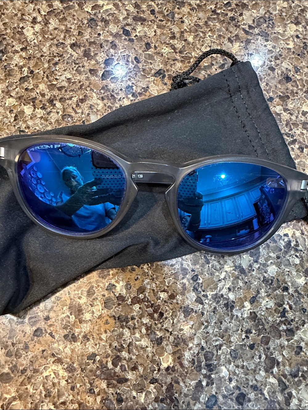 Oakley Men's Sunglasses with Blue Mirrored Lenses and Black Frame